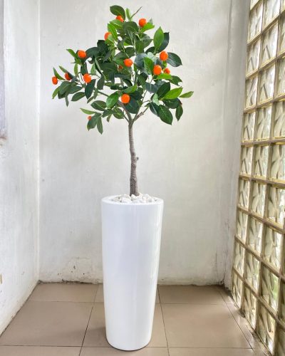 fiberglass vase potted with an artificial orange tree