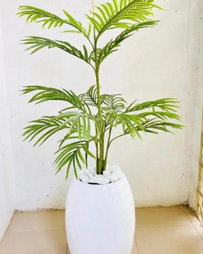Add a touch of tropical elegance to your home or office with the Artificial Single Stem Palm, potted in a Classic Fiberglass Vase.